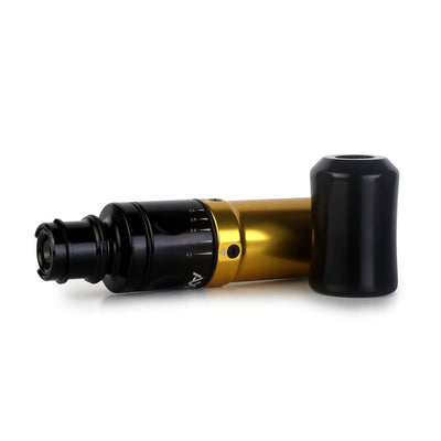 A gold pen tattoo machine laying horizontally. Axys Valhalla pen machine are available at Kingpin. 