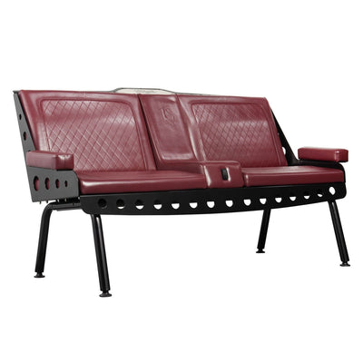 An Ox Blood colored Comfort Before Pain Waiting Room Bench by TATSoul with quilted vinyl seating and a black metal frame. 